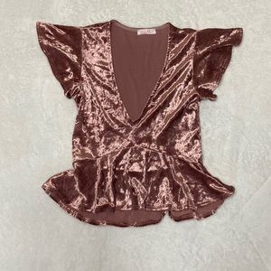 Pink velvet low cut crop with peddled sleeves and waist line